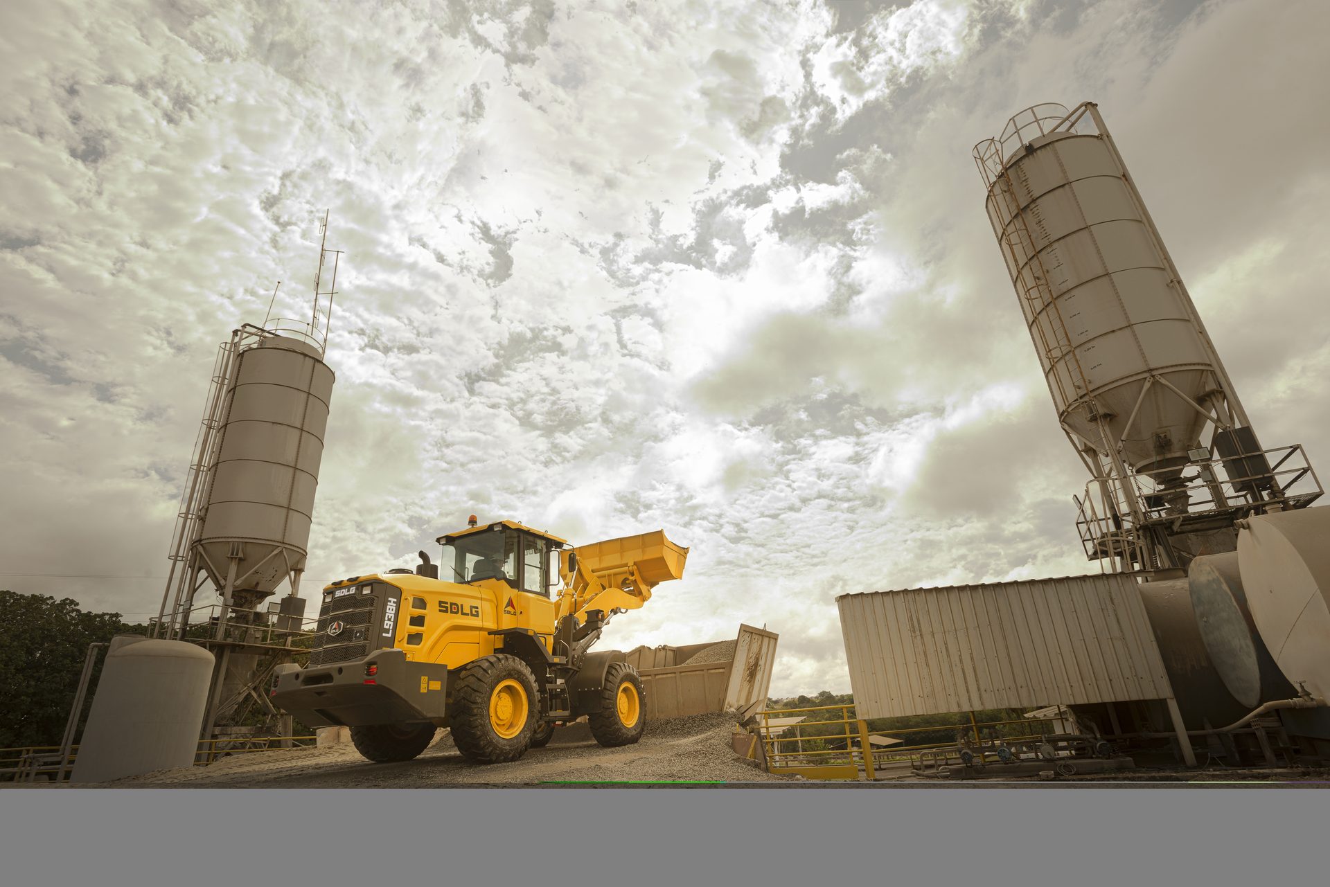 L938H in an industrial yard between silos