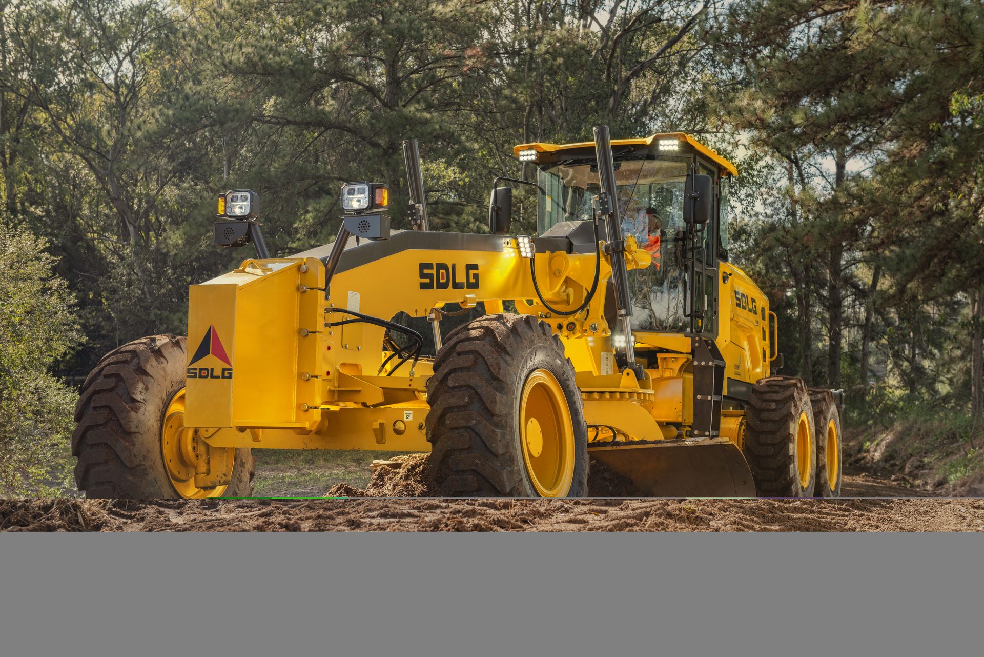 SDLG motor grader on a highway